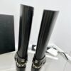 CHANEL riding boots with CC and chain at back