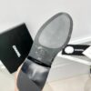 CHANEL riding boots with CC and chain at back