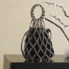 Chanel Métiers d’Art Runway black embellished tweed & leather chain link net bag with gold hardware