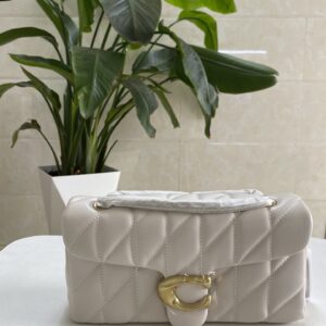 Home coach quilted tabby shoulder bag