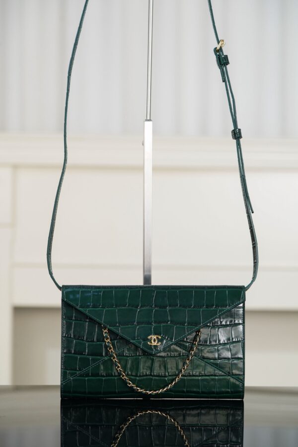 CHANEL Clutch with Leather Strap
