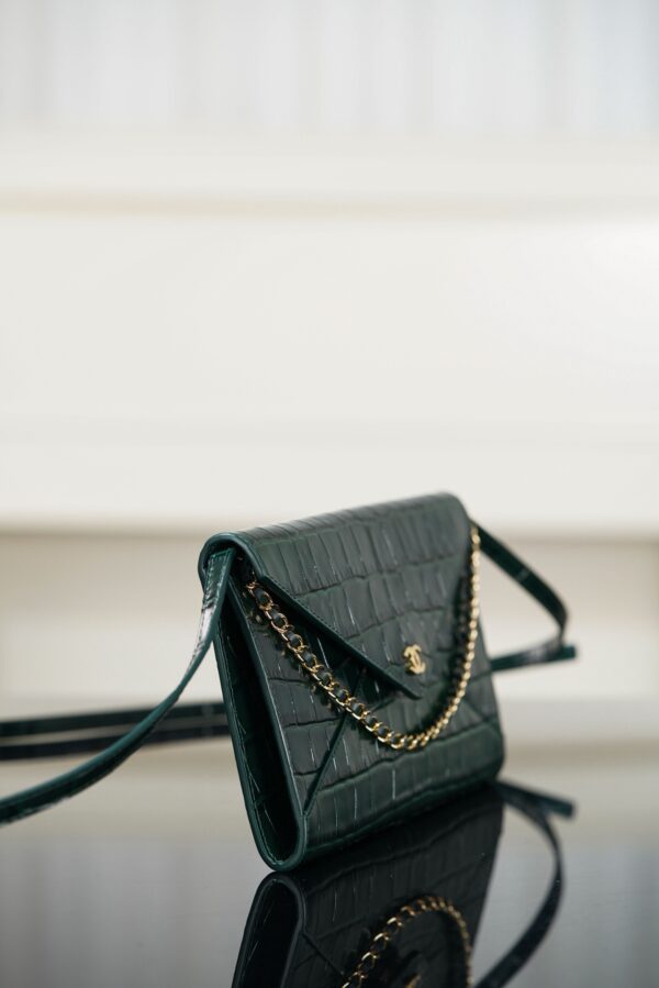 CHANEL Clutch with Leather Strap