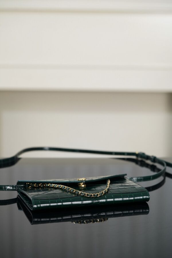 CHANEL Clutch with Leather Strap