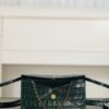 CHANEL Clutch with Leather Strap