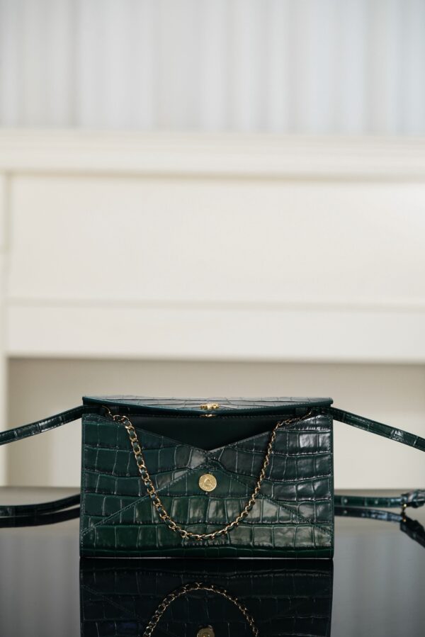 CHANEL Clutch with Leather Strap