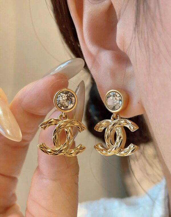 chanel pendant embossed cc earrings