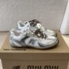 MIUMIU NB 530 SL metallic leather and mesh sneakers