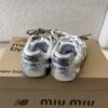 MIUMIU NB 530 SL metallic leather and mesh sneakers